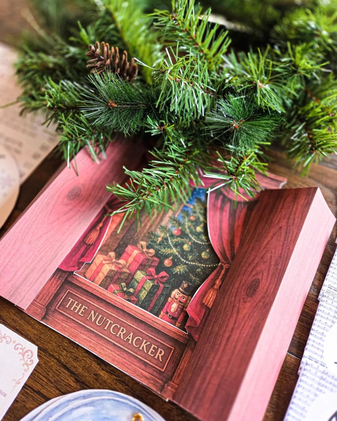 Christmas-themed book titled 'The Nutcracker' with a decorative wreath on top