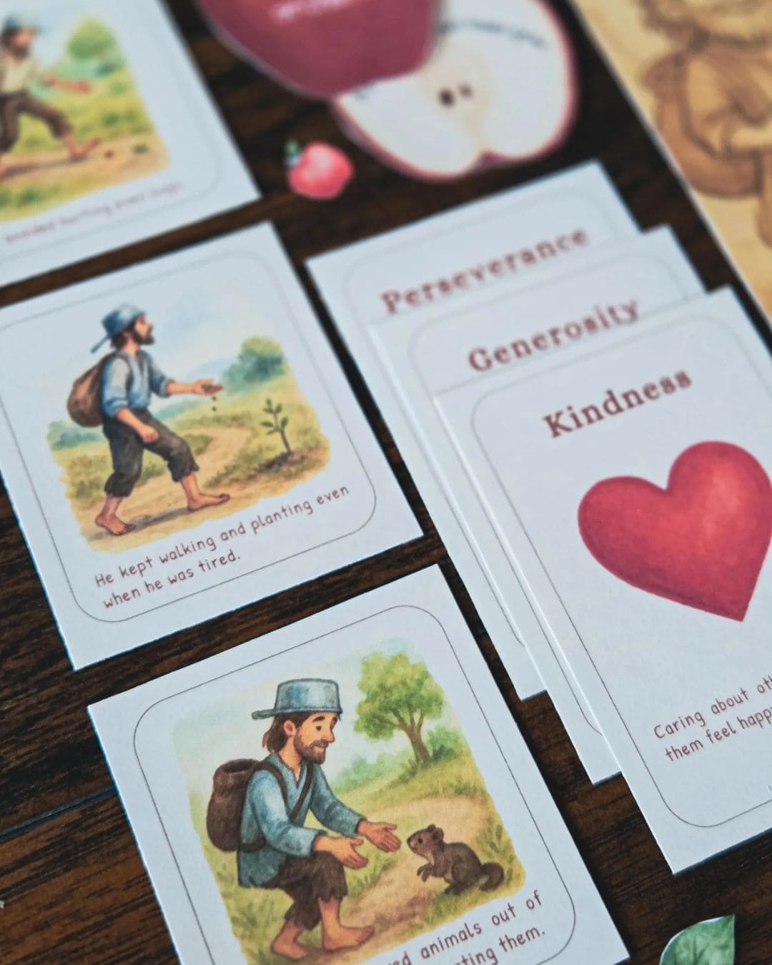 Character trait cards featuring Johnny Appleseed with themes like perseverance and kindness from homeschool book study