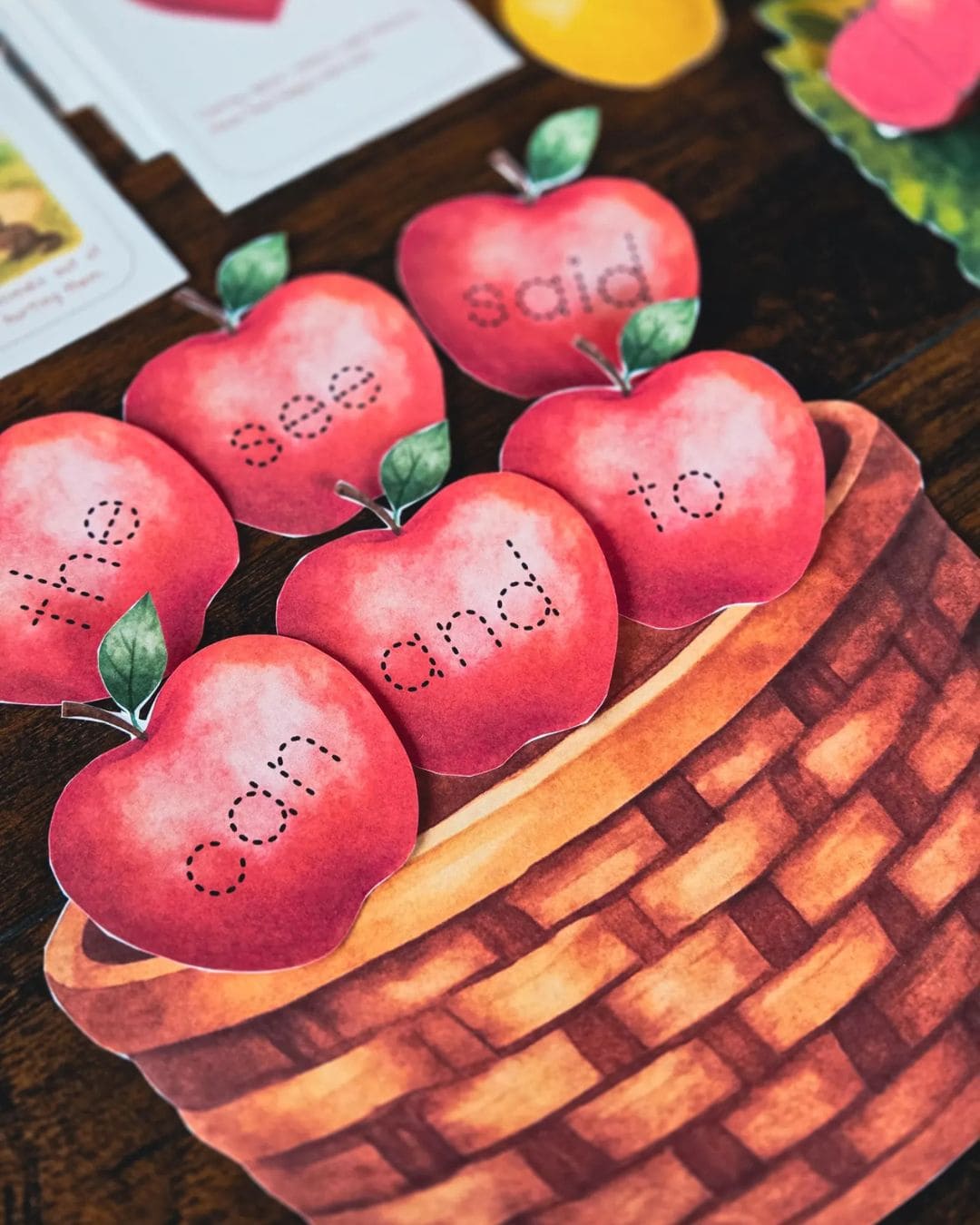 Close-up of red apples in basket craft used in Johnny Appleseed book study for preschool and elementary learners