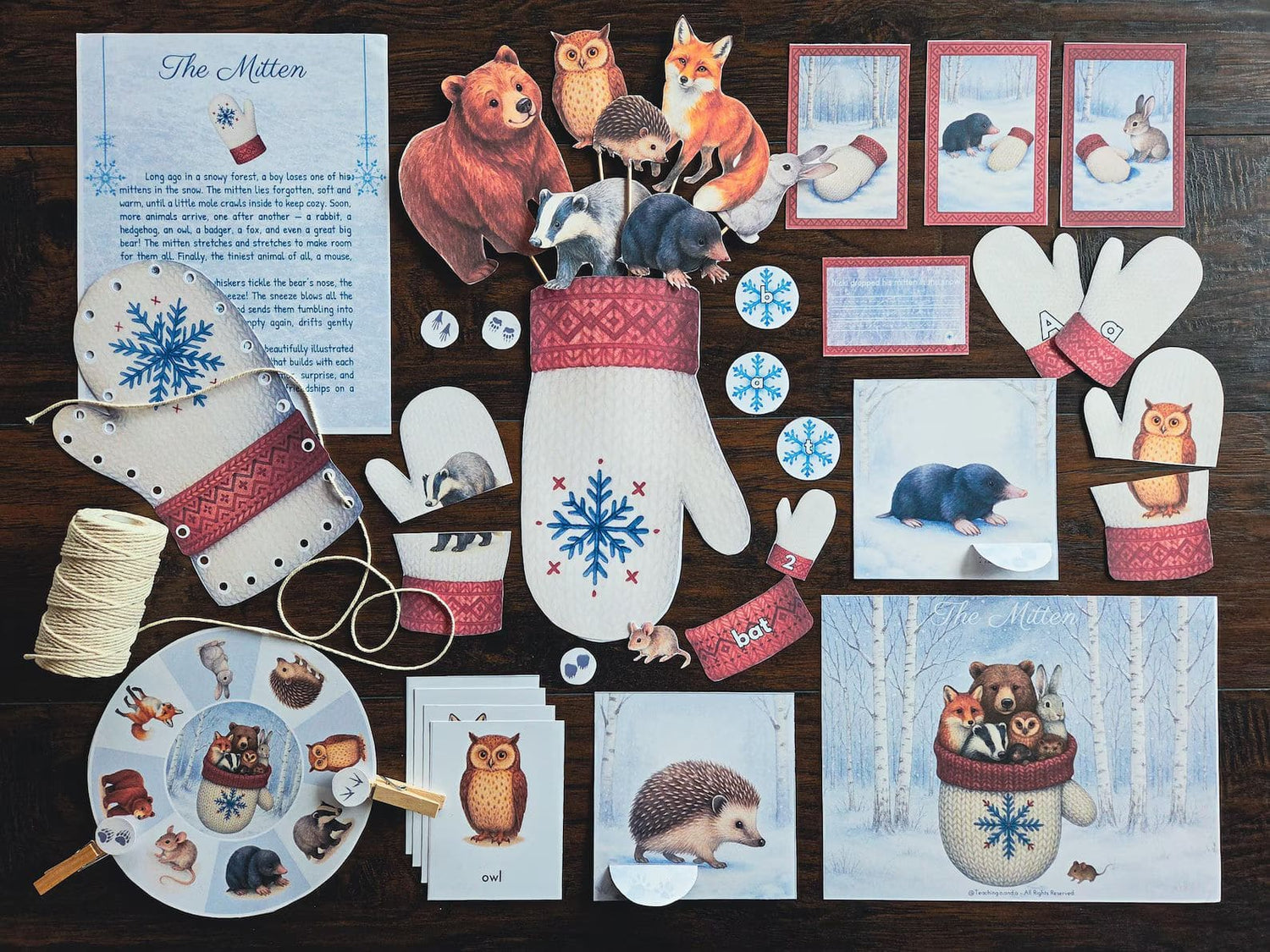 Flatlay of The Mitten homeschool book study with printable mitten craft, animal cutouts, cards, and story elements